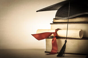 bigstock-Graduation-Scroll-And-Book-Sta-51249898